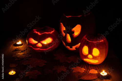 three halloween jack o lantern pumpkins
