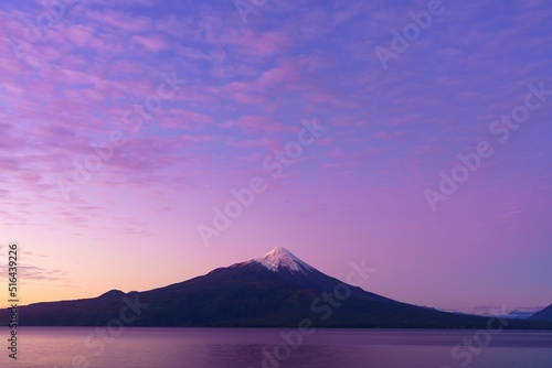 Beautiful view of the purple sunset, lake and mountain, Osorno Volcano photo