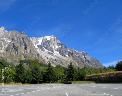 Mont Blanc, the highest peak of the Alps on the border of Italy and France. High mountains with snowy peaks against the blue sky, beautiful landscape Monte Blanco