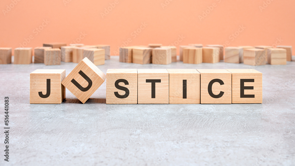 Fototapeta premium JUSTICE word written on wood block - text on wooden table for your desing, concept.
