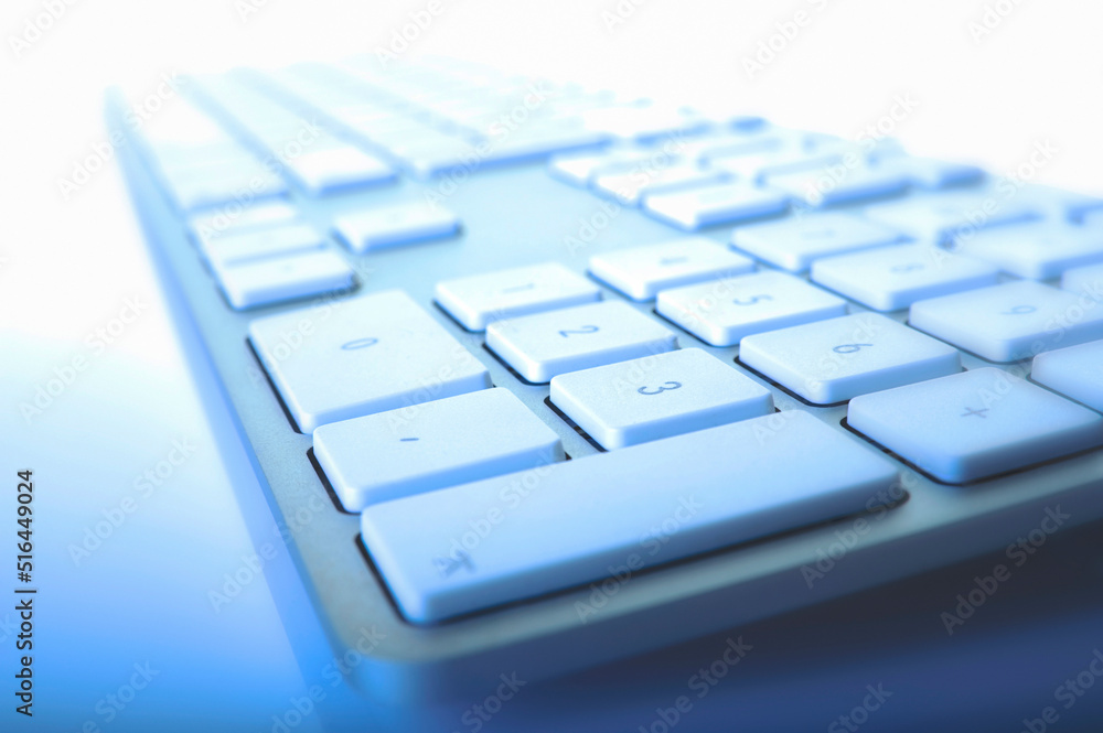 Computer Keyboard Close-Up Shot in Blue Color on White Computer Keyboard Close-Up Shot in Blue Color on White