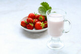 yogurt with strawberries in a glass.