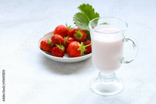 yogurt with strawberries in a glass.