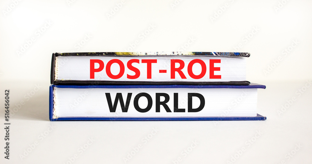 Roe vs Wade post-Roe world symbol. Concept words Post-Roe world on books on a beautiful white table white background. Business and Roe vs Wade post-Roe world concept. Copy space.