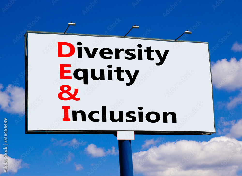 DEI, Diversity equity and inclusion symbol. Concept words DEI diversity equity and inclusion on billboard against beautiful blue sky and clouds. Business DEI diversity equity and inclusion concept. DEI, Diversity equity and inclusion symbol. Concept words DEI diversity equity and inclusion on billboard against beautiful blue sky and clouds. Business DEI diversity equity and inclusion concept.