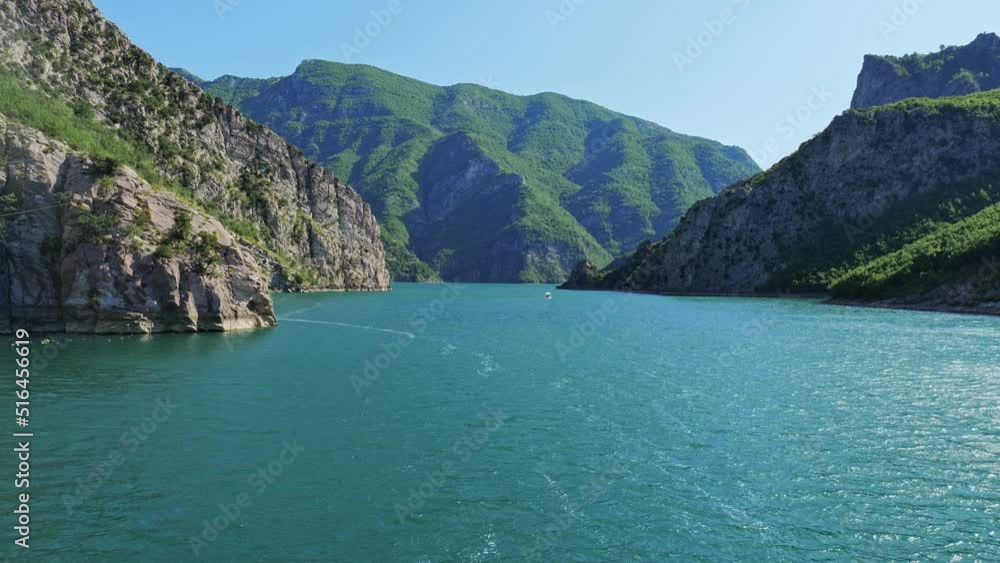 Komani Lake ferry cruise boat view near the town of Fierz, Albania. Komani Lake is a popular tourist destination in Albania. Komani Lake ferry cruise boat view near the town of Fierz, Albania. Komani Lake is a popular tourist destination in Albania.