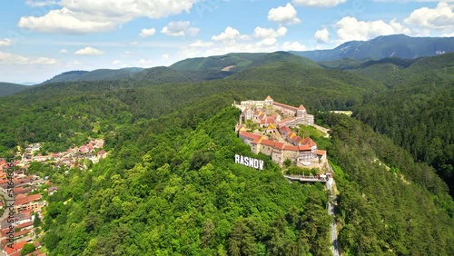 Wallpaper Mural Aerial drone view of The Rasnov Fortress in Romania. Medieval fortress with Rasnov inscription on the top of the hill and town, Carpathians Torontodigital.ca