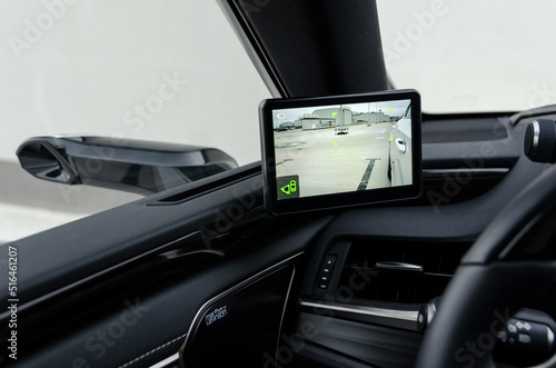 Screen of digital mirror, view with part of the car, new automotive technology