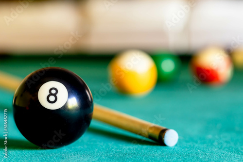 Картината върху платно Billiard eight ball on green tapestry