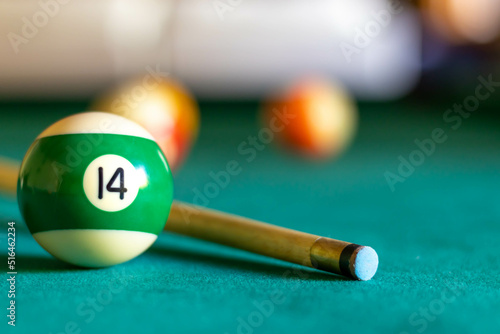 Billiard fourteen ball on green tapestry