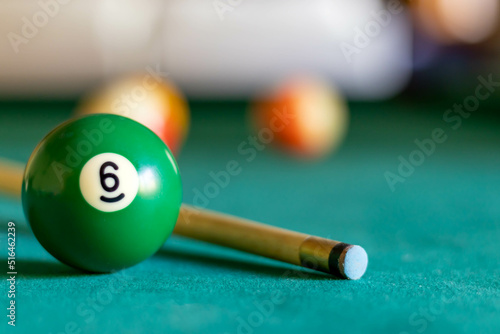 Billiard six ball on green tapestry