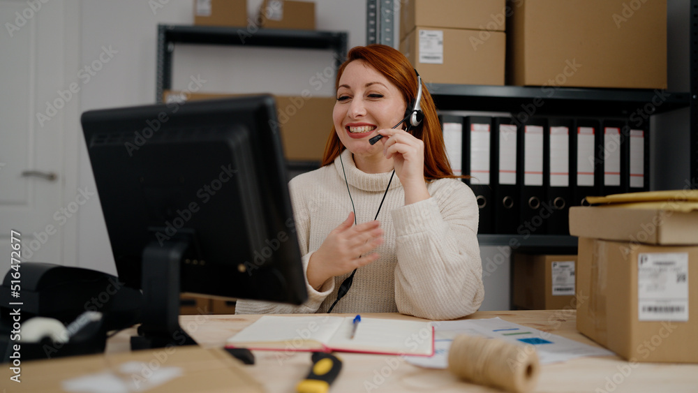 Young redhead woman ecommerce call center agent having video call at office Young redhead woman ecommerce call center agent having video call at office