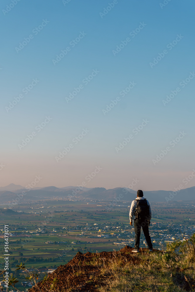 hispanic male hiking in mountains