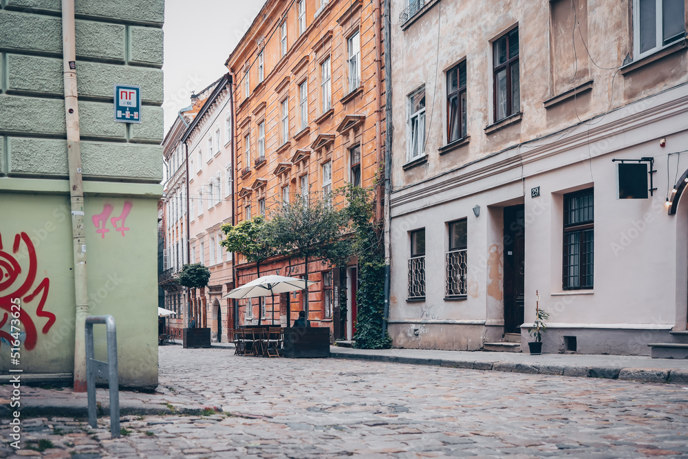 Traditional buildings in a cobblestone street in historical Old town of Lviv.