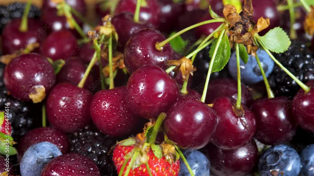 Background of fresh ripe fruit. Raw dark cherry, strawberry, blueberries, mulberries. Sweet ripe juicy and organic fruit Background of fresh ripe fruit. Raw dark cherry, strawberry, blueberries, mulberries. Sweet ripe juicy and organic fruit