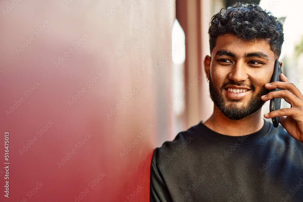 Young arab man smiling confident talking on the smartphone at street Young arab man smiling confident talking on the smartphone at street