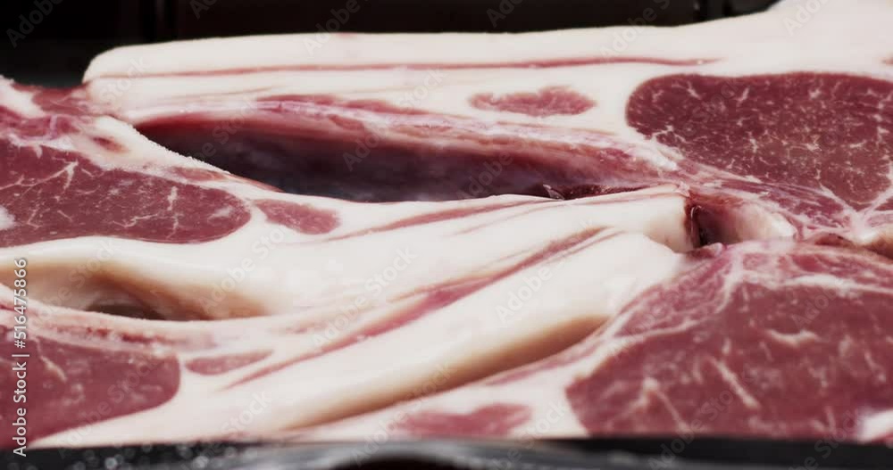 Close-up move camera - Ice flakes on frozen lamb raw packaged, Food concept. Close-up move camera - Ice flakes on frozen lamb raw packaged, Food concept.