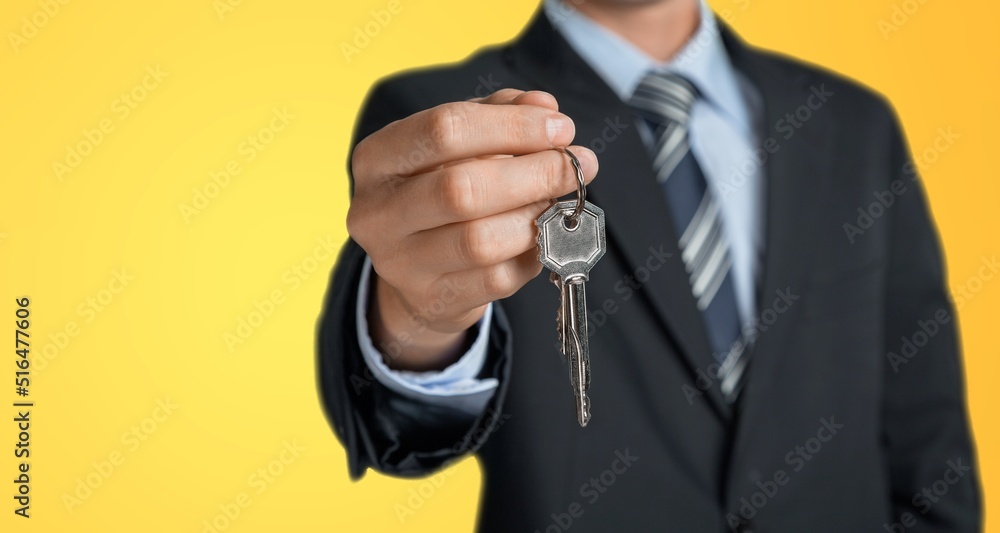 Young man hold give car key. People lifestyle concept Young man hold give car key. People lifestyle concept