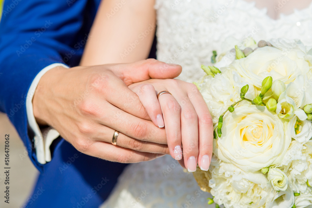 The couple cuddling and holding bridal bouquet. The couple cuddling and holding bridal bouquet.