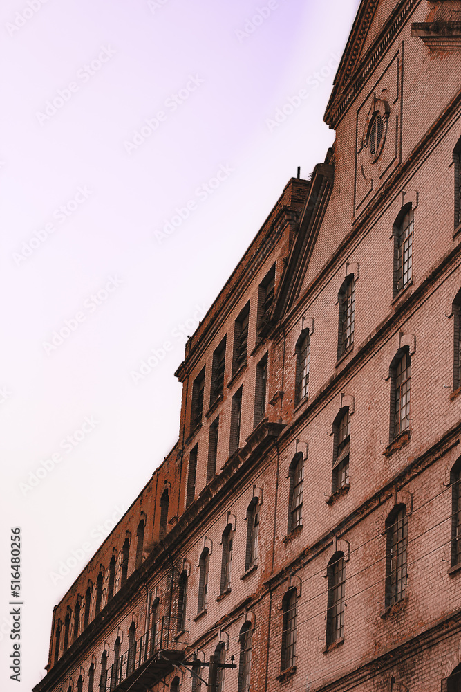 Obraz premium architecture photo, old factory, urban photo, street photo, pixação and graffiti, urbanism. old building, . spray graffiti , traffic sign and lamp post, background sky