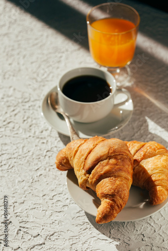 delicious breakfast, coffee and croissants on the table 