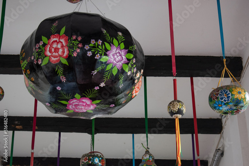 Handmade lamp from Chiapas hanging on the ceiling.