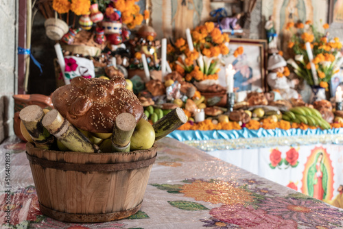 Mexican offering of the day of the dead with bread and fruit.