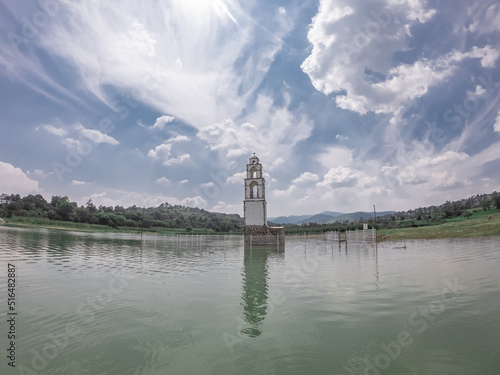 Church bell tower submerged in dam in Mexico.
