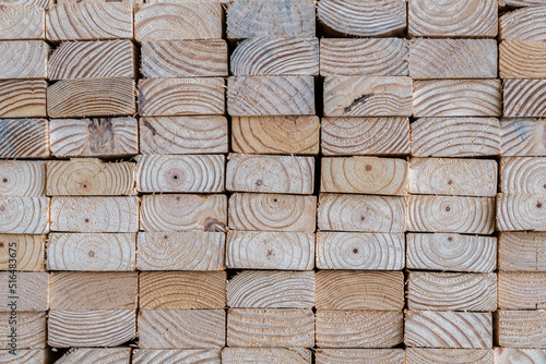 Canvas Print Photograph of the end profile of a stack of 2 x 4 studs in a lumber yard featuri