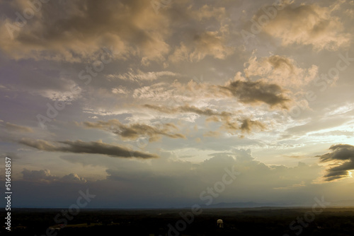 At sunset, storm clouds create a dramatic panorama of landscape view