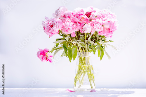 Bouquet of pink peonies on a light background. 