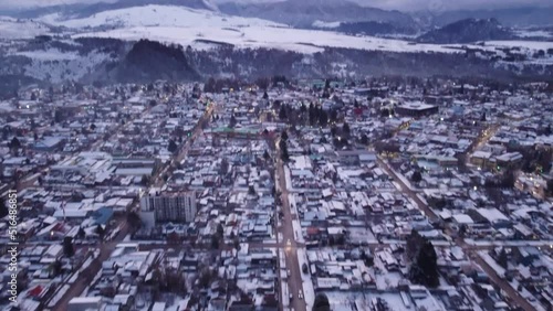Volando sobre la ciudad de Coyhaique nevada  photo