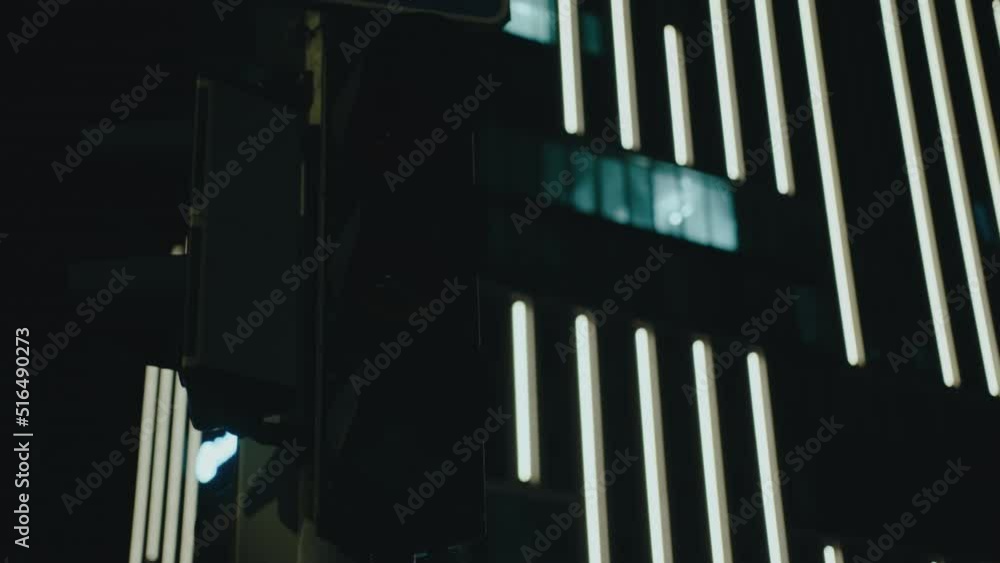 Close-up of flashing amber traffic light in city at night Close-up of flashing amber traffic light in city at night