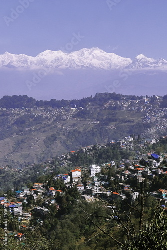 snowcapped himalaya (kangchenjunga or sleeping buddha range), scenic birds eye view of darjeeling hill station in west bengal, india
