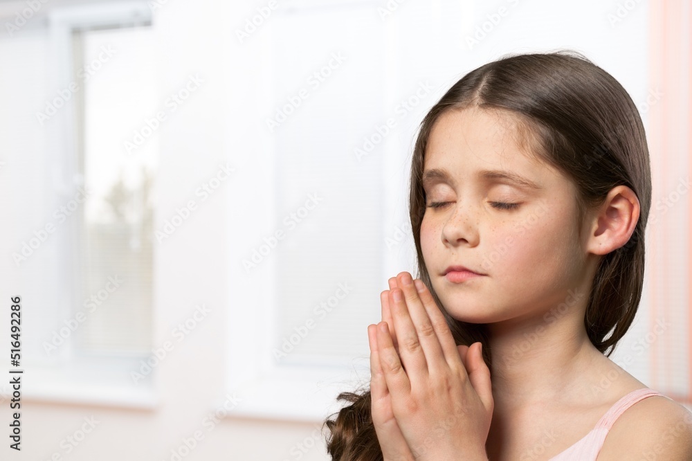 Young kid standing next to window with wondering face. Relaxing in room apartment in city Young kid standing next to window with wondering face. Relaxing in room apartment in city