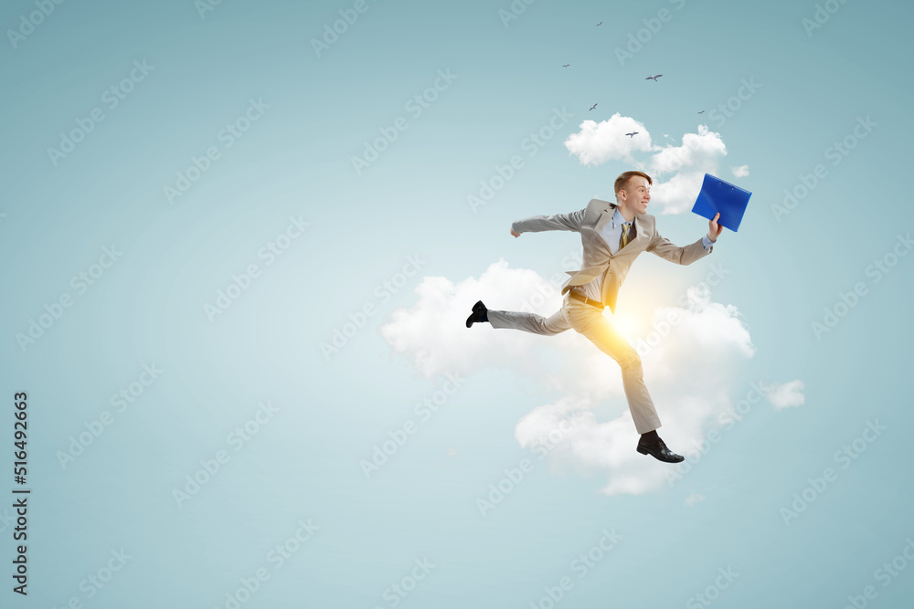 Portrait of energetic businessman jumping in open air Portrait of energetic businessman jumping in open air