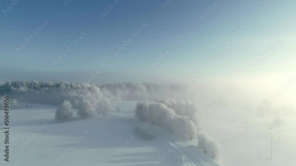 Cinematic View Of Sunlight Through Winterly Landscape In Countryside. Aerial Drone Shot Cinematic View Of Sunlight Through Winterly Landscape In Countryside. Aerial Drone Shot