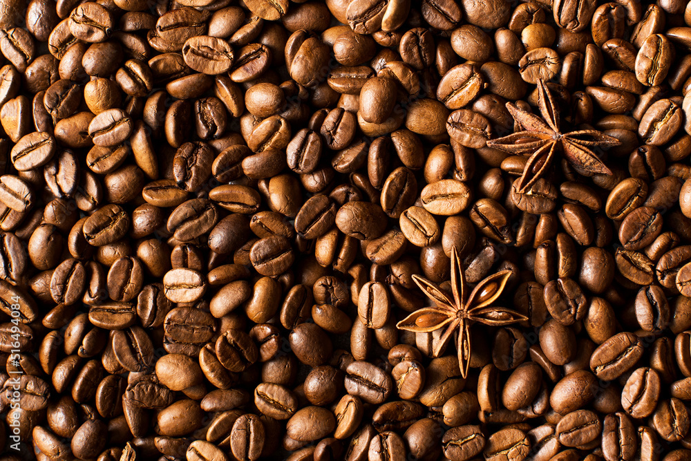 Fototapeta premium Background of roasted coffee beans full frame and star anise. 