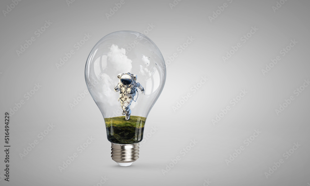 Spaceman inside light bulb . Mixed media Spaceman inside light bulb . Mixed media