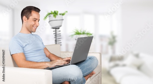 Entrepreneur of business young man working online with laptop and celebrating at home,Small Business Startup concept