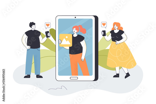 Blogger on phone screen showing pictures to audience. Tiny man and woman giving likes flat vector illustration. Blog content, social media concept for banner, website design or landing web page