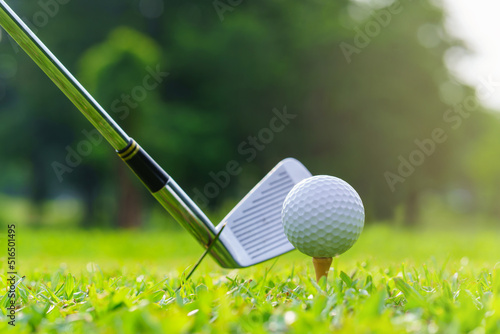 Man Golfer Hitting Ball with Club on Beatuiful Golf Course