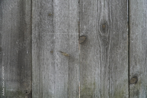 Texture of an old fence made of wooden boards close-up