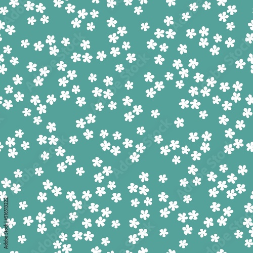 Simple vintage pattern. small white flowers. turquoise background. Fashionable print for textiles and wallpaper.