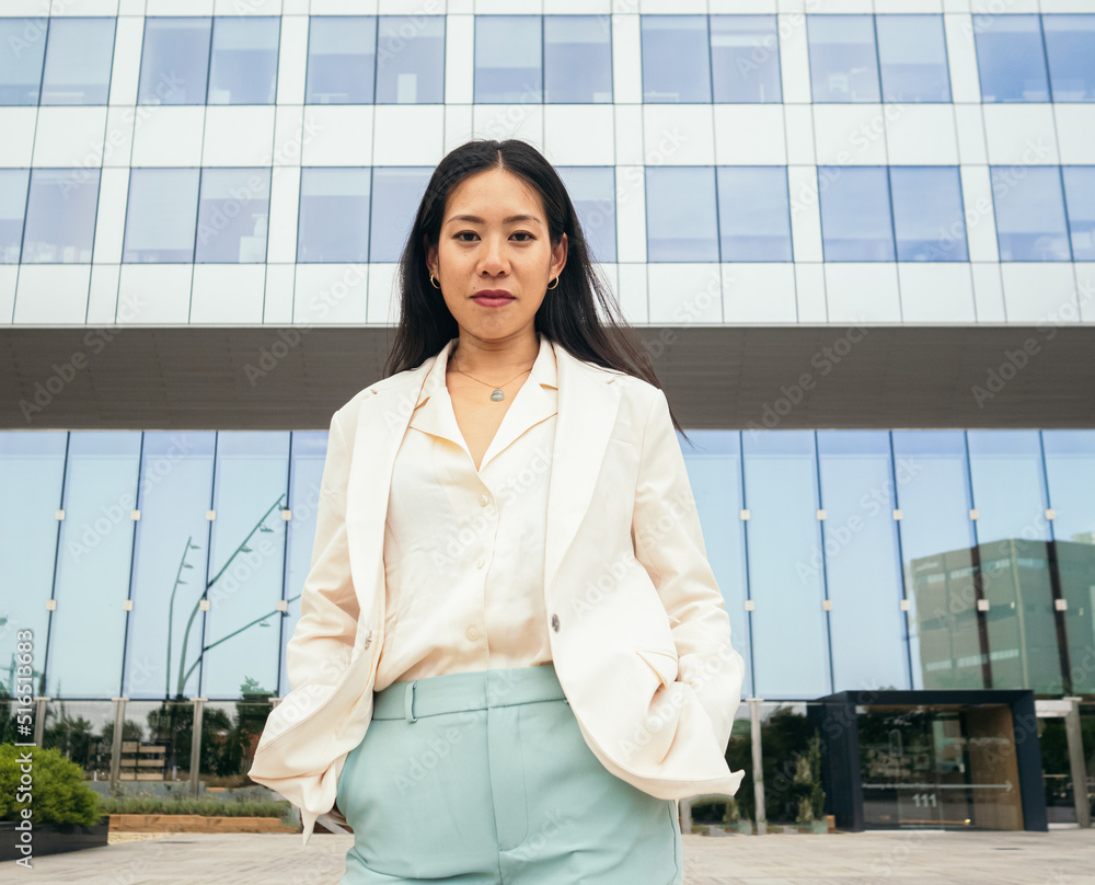 Portrait of a young Asian business woman looking at camera. Women entrepreneurs, female empowerment, business women Portrait of a young Asian business woman looking at camera. Women entrepreneurs, female empowerment, business women