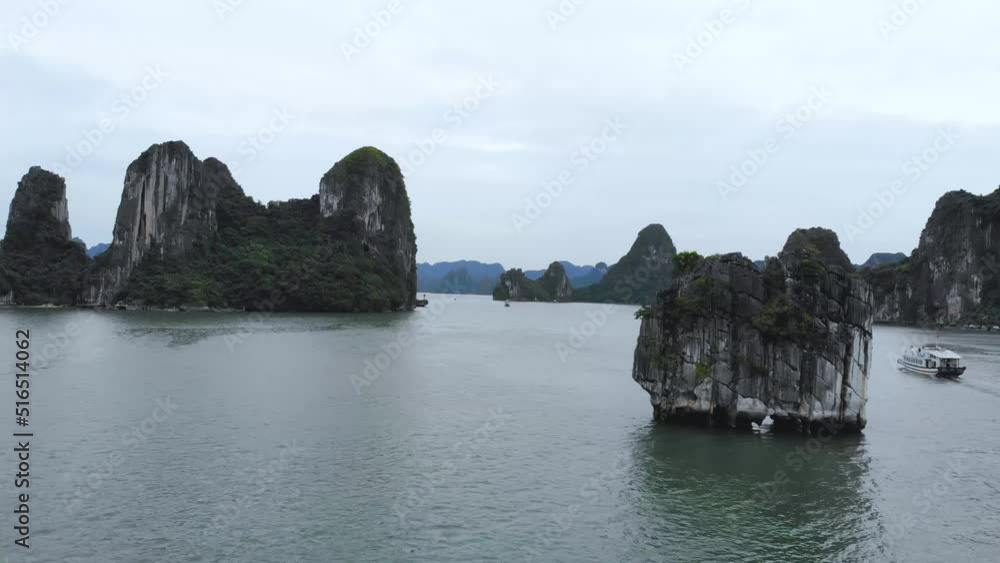 Aerial view panorama of floating fishing village and rock island, Halong Bay, Vietnam, Southeast Asia. UNESCO World Heritage Site. Junk boat cruise to Ha Long Bay Aerial view panorama of floating fishing village and rock island, Halong Bay, Vietnam, Southeast Asia. UNESCO World Heritage Site. Junk boat cruise to Ha Long Bay