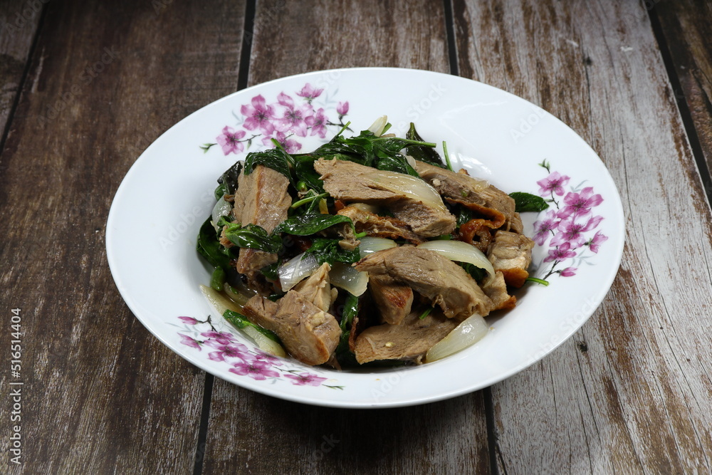 Traditional spicy duck meat mixed with basil and onion serving on the plate. Famous menu in Chinese restaurant. Traditional spicy duck meat mixed with basil and onion serving on the plate. Famous menu in Chinese restaurant.