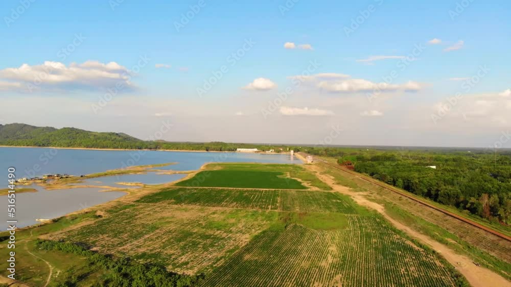 Aerial view of Dau Tieng lake, Tay Ninh province, Vietnam. Blue sky and clear water. Stunning views. This is also a famous tourist destination. Ba Den mountain in cloud. Aerial view of Dau Tieng lake, Tay Ninh province, Vietnam. Blue sky and clear water. Stunning views. This is also a famous tourist destination. Ba Den mountain in cloud.