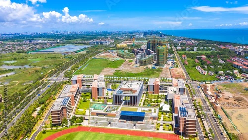 Aerial Hyperlapse of Landmark Buildings in Haikou Jiangdong New District, Hainan Free Trade Zone, Including Ecological, Industrial and Urban Facilities.