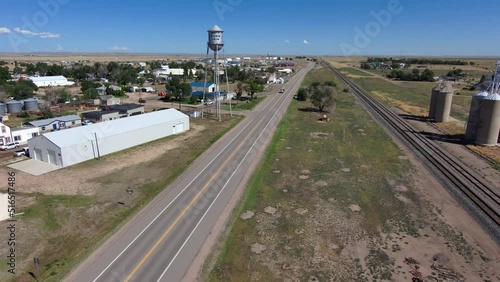 Flight towards Nunn Colorado water tower which reads watch Nunn grow. photo